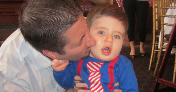 father son kiss cheek